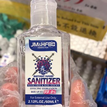 Foody World - a hand holding a bottle of sanitizer - International Grocery Near Me - Richmond, British Columbia Foody World - a hand holding a bottle of sanitizer - International Grocery Near Me - Richmond, British Columbia
