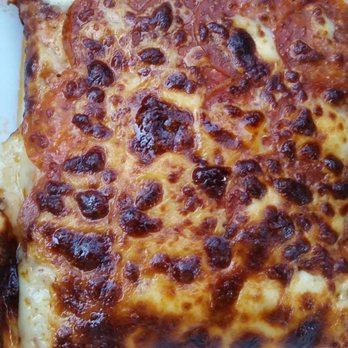 Rocky Rococo Pan Style Pizza - REALLY?   YOU FELT GOOD SERVING THIS CRAP?  Look at your order before you leave.  Lacked sauce, small amount by edges only.  In the GARBAGE - Pizza Near Me - Milwaukee, Wisconsin