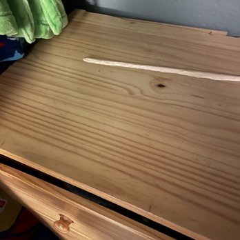 Quality Movers - Three-foot length of wood sheared off the back of the dresser. How the heck do you do that?? - Movers Near Me - Wheeling, Illinois Quality Movers - Three-foot length of wood sheared off the back of the dresser. How the heck do you do that?? - Movers Near Me - Wheeling, Illinois