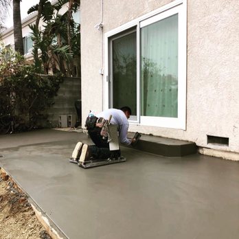 Master Loco Construction - a man working on a concrete patio - Masonry/Concrete Near Me Master Loco Construction - a man working on a concrete patio - Masonry/Concrete Near Me