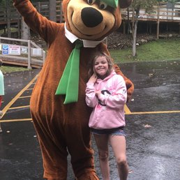 My daughter with the grand master of ceremonies, Yogi bear at the flag raising ceremony