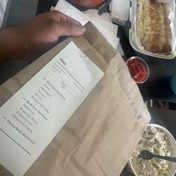 Pastaphony - Receipt with Arrabbiata sauce and next to it is regular Alfredo sauce. - Italian Near Me - Long Beach, California