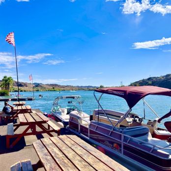 Foxs RV Resort - a man loading a boat onto a dock - Bars Near Me - Parker, Arizona Foxs RV Resort - a man loading a boat onto a dock - Bars Near Me - Parker, Arizona