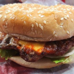 a hamburger with cheese and lettuce