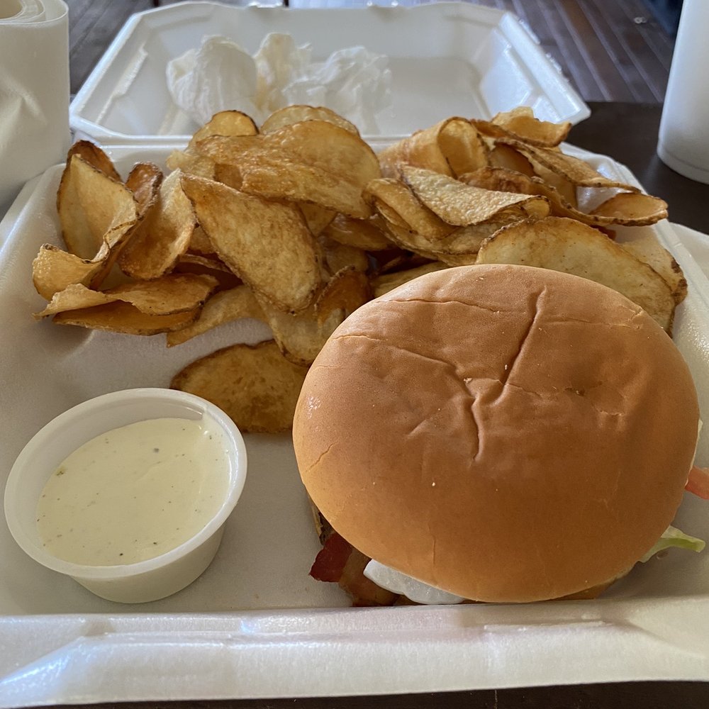 a burger and chips on a tray a burger and chips on a tray