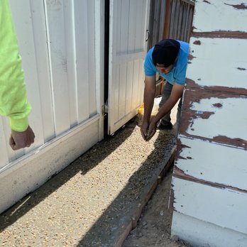 Pmc Tree Service - Martin spreading pebbles on the concrete - Tree Services Near Me - San Jose, California