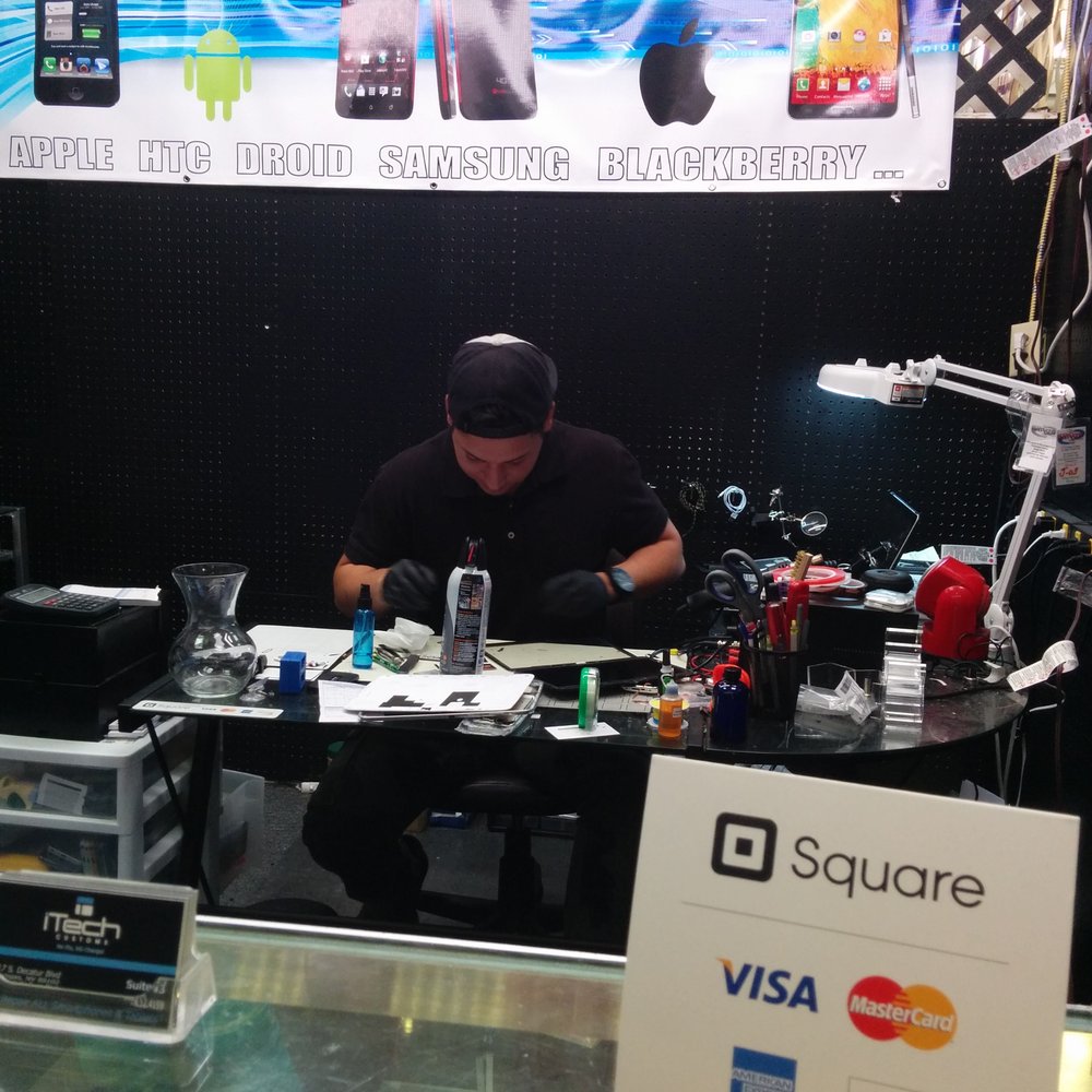 iTech Customs - Tech working on equipment - Electronics Repair Near Me - Las Vegas, Nevada