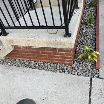 Jimenez Landcare - a sidewalk with a black iron fence - Landscaping Near Me Jimenez Landcare - a sidewalk with a black iron fence - Landscaping Near Me