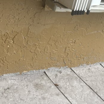AA Concrete Solutions - Wall paint splattered with cement - Masonry/Concrete Near Me