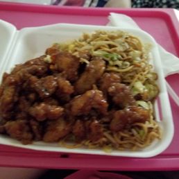 Orange chicken with chow mein and fried rice. Orange chicken with chow mein and fried rice.