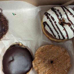 three donuts in a box three donuts in a box