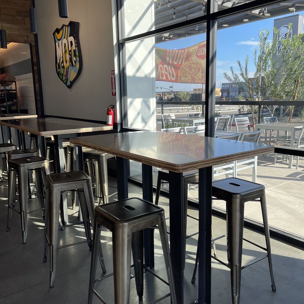 MOD Pizza - tables and stools in a restaurant - Pizza Near Me - Surprise, Arizona MOD Pizza - tables and stools in a restaurant - Pizza Near Me - Surprise, Arizona