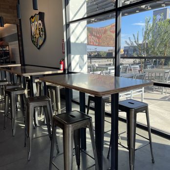 MOD Pizza - tables and stools in a restaurant - Pizza Near Me - Surprise, Arizona