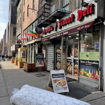 Olympia Deli - person holding a sandwich - Juice Bars & Smoothies Near Me - New York, New York Olympia Deli - person holding a sandwich - Juice Bars & Smoothies Near Me - New York, New York