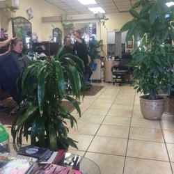 H V Hair Salon & Barber - Hubby getting a haircut while our kids are playing at there golf tournament at Carlton Oaks.