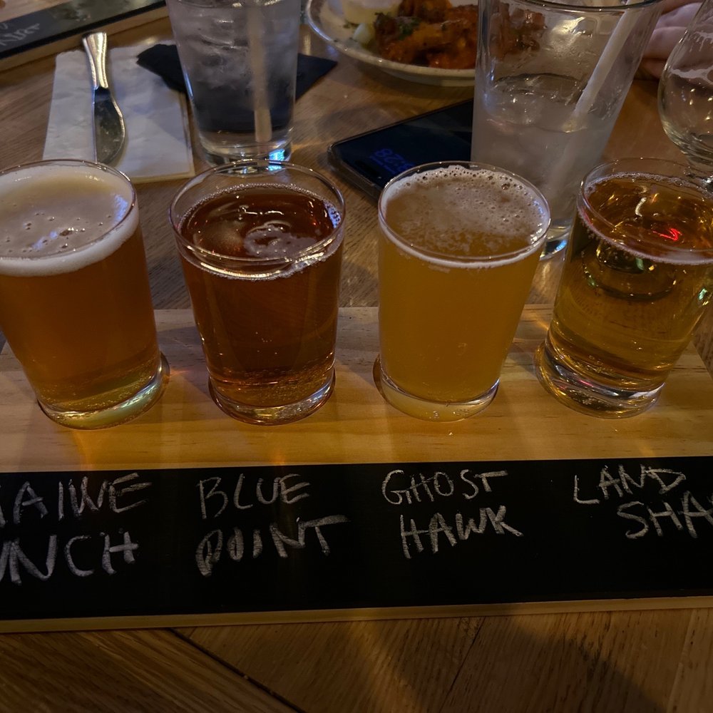 River and Henley - a flight of beers on a table - New American Near Me - New Milford, New Jersey River and Henley - a flight of beers on a table - New American Near Me - New Milford, New Jersey