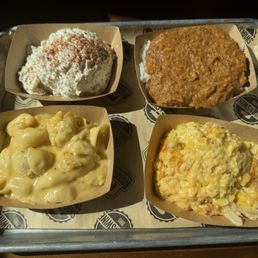 Side sampler (L-R) potato salad, hash and rice, corn pudding, Mac & cheese Side sampler (L-R) potato salad, hash and rice, corn pudding, Mac & cheese