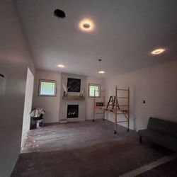 Morgan Master Electrician Company - Same living room and same fireplace. Now under repair. The new recessed lights with nightlight function installed and look fantastic!
