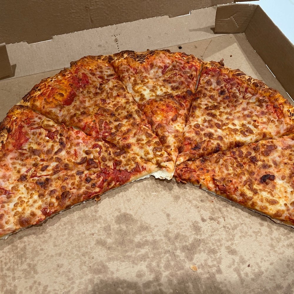 Burned cheese pizza. So bad we couldn't even finish it Burned cheese pizza. So bad we couldn't even finish it
