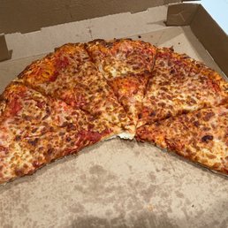 Burned cheese pizza. So bad we couldn't even finish it