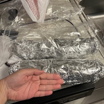 Pho House - a person's hand holding a bag of food - Vietnamese Near Me - Ypsilanti, Michigan Pho House - a person's hand holding a bag of food - Vietnamese Near Me - Ypsilanti, Michigan