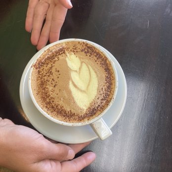 Wholesome Cafe - Tatiana's amazing turmeric latte with a lightly dusted cinnamon rim....Talk about talent!! 3 - Coffee & Tea Near Me - Cottonwood, Arizona Wholesome Cafe - Tatiana's amazing turmeric latte with a lightly dusted cinnamon rim....Talk about talent!! 3 - Coffee & Tea Near Me - Cottonwood, Arizona