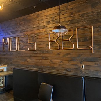 Moe's BBQ - a wood paneled wall with the word moe's bbq on it - Barbeque Near Me - Ottawa, Ontario