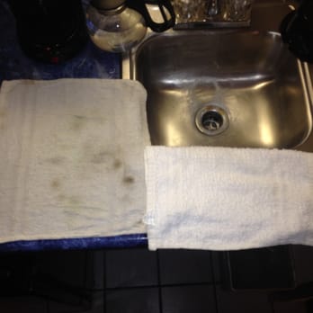 Atrium the Inn - Wash cloth used to clean sink/light fixture/unused coffee pot in kitchenette area compared to a clean wash cloth on right. - Hotels Near Me - Fort Stockton, Texas