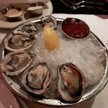 Cutters Crabhouse - Seasonal WA oysters, bloody mary sauce, cucumber mignonette, not in the picture as someone else had a finger in it to taste. - Seafood Near Me - Seattle, Washington Cutters Crabhouse - Seasonal WA oysters, bloody mary sauce, cucumber mignonette, not in the picture as someone else had a finger in it to taste. - Seafood Near Me - Seattle, Washington