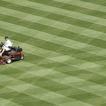 Alfredos lawn service - a man on a lawn mower - Lawn Services Near Me