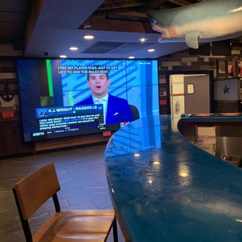 Juicy Seafood - a man on a television screen - Seafood Near Me - Cleveland, Tennessee