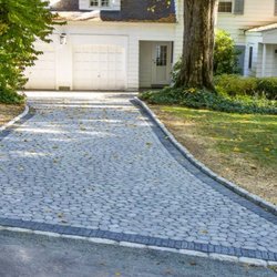 MG's Lawn Green Inc - River rock themed driveway in memory of a fly fisherman in NY.