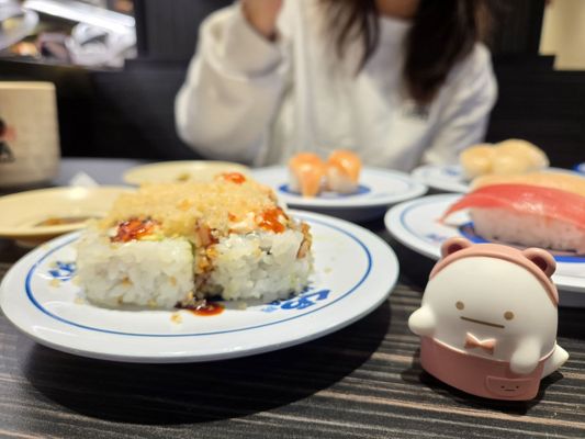 Kura Revolving Sushi Bar by null