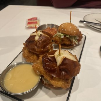Harry & Izzy's - Fried chicken sliders on pretzel bun with honey mustard Mayo and fried shrimp Slider - Steakhouses Near Me - Indianapolis, Indiana