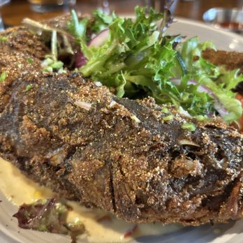 Lucille's - While branzino fish fry. Meat texture was very mushy. - New American Near Me - Houston, Texas