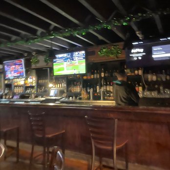 Trinity Pub - a man sitting at the bar - Irish Pub Near Me - Chicago, Illinois