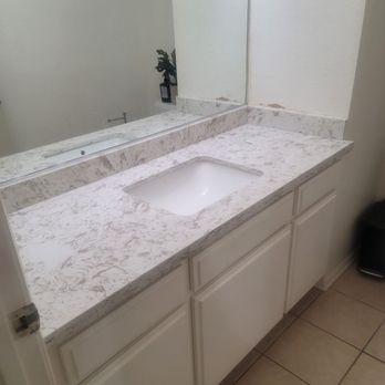 New Level Stone & Tile - As they were putting on countertop in bathroom. - Countertop Installation Near Me