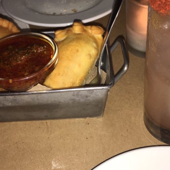 Tabaré Williamsburg - DELICIOUS empanadas with yummy olive base dipping salsa!! And our happy hour drinks pictured to the side. - Latin American Near Me - Brooklyn, New York Tabaré Williamsburg - DELICIOUS empanadas with yummy olive base dipping salsa!! And our happy hour drinks pictured to the side. - Latin American Near Me - Brooklyn, New York