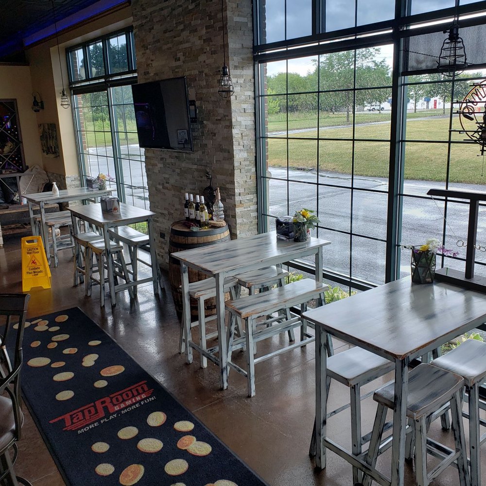 tables and chairs in front of a large window tables and chairs in front of a large window