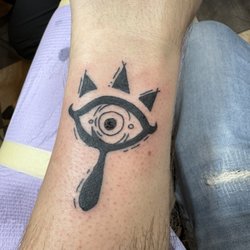 Mutiny Tattoo & Piercing - Tattoo of a Sheikah eye