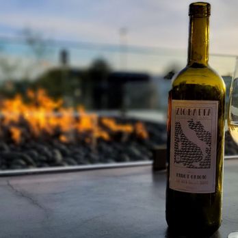 Del Lusso - Great wine at a nice fireplace at DelLusso! - Pizza Near Me - Carlsbad, California