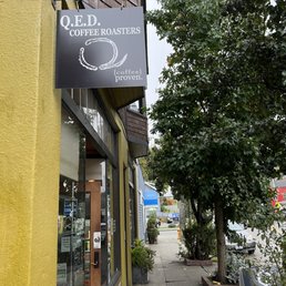 a sign for a coffee shop a sign for a coffee shop