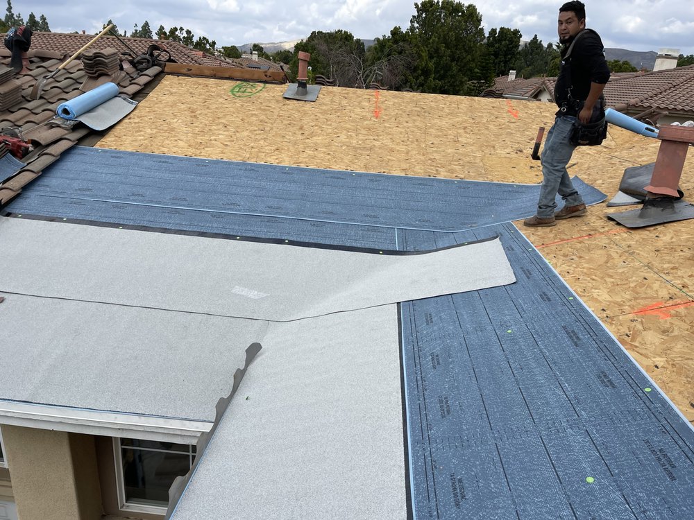 Slide of Rudy’s roofing