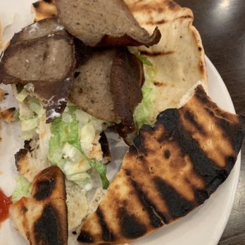 2 Creeks Bar & Grill - Supposed to be a gyro. One bite and it fell apart into this burnt steak-umm like mess.  Special of the day. - Bars Near Me - St. Augustine, Florida