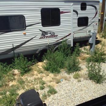 Red Desert Rose Campground - Weeds around trailer. - Campgrounds Near Me - Rawlins, Wyoming