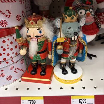 Walgreens - Two nutcracker decorations dressed as kings are placed on a store shelf, with holiday-themed packaging and other Christmas decorations visible in the background. - Drugstores Near Me - Laurel, Maryland