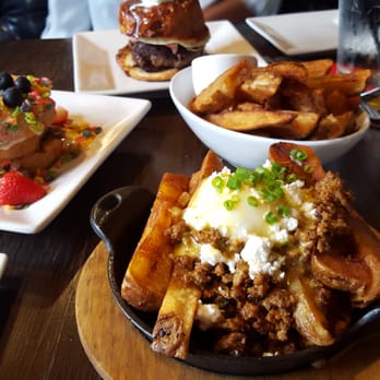 Bosscat Kitchen & Libations - Huevos estrallados benedict, bosscat fries, fruity pebbles french toast, sticky bin breakfast burger - New American Near Me - Irvine, California