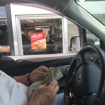 Gino's Burger & Chicken - a man sitting in a car holding money - American Near Me - Glen Burnie, Maryland Gino's Burger & Chicken - a man sitting in a car holding money - American Near Me - Glen Burnie, Maryland