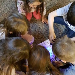 Friendly Care Day School - Our afterschoolers work together to complete a STEM Break-out.