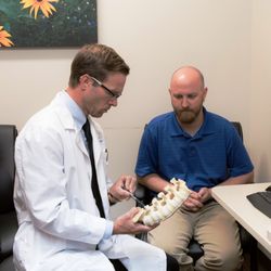 Orthopaedic & Spine Center of The Rockies - Lafayette - Dr. Gerlach discusses spine anatomy with a patient